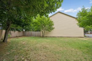 Tree-shaded lawn and mature landscaping at Roberts Court Townhomes