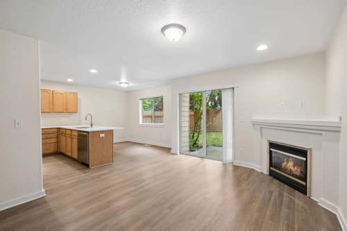 3-bedroom townhome living room with fireplace and sliding patio door