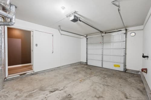 Attached single-car garage with overhead door opener