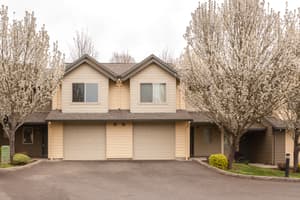 Roberts Court exterior with mature landscaping and blooming trees