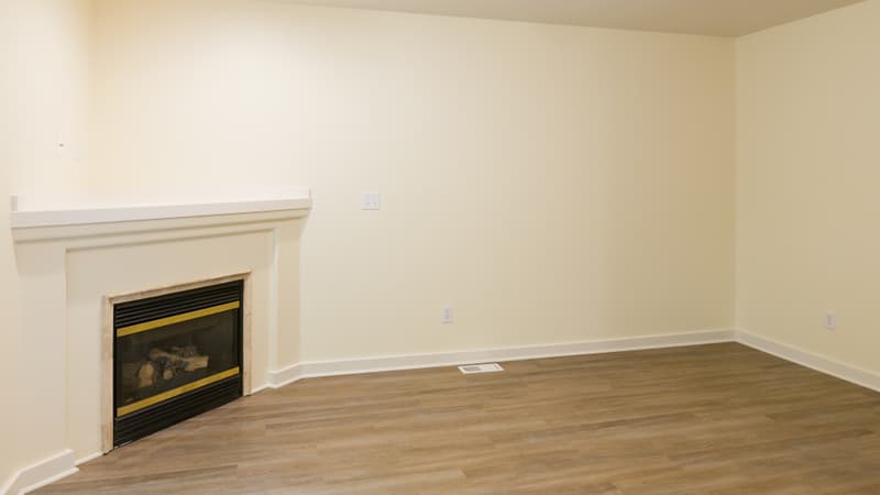 Roberts Court Townhomes living room with wood-style flooring and fireplace